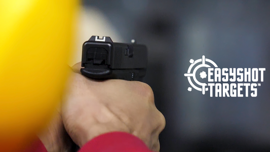 man pointing gun