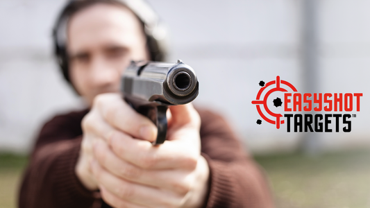 man pointing gun and focusing at target