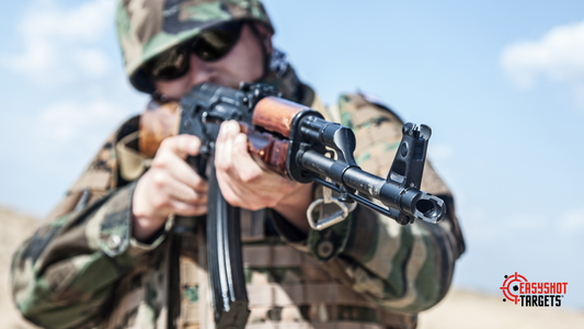 Man in army uniform pointing a gun