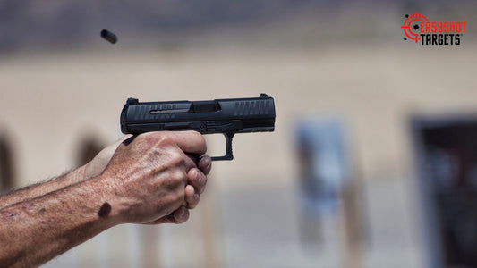 A man holding a gun with his finger on the trigger