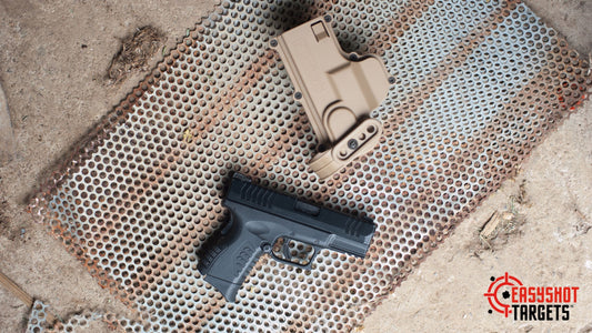 A gun and holster on steel with holes in it